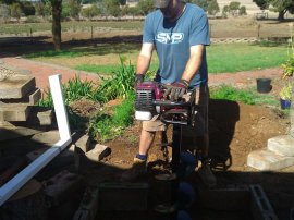 Digging a drainage/soakage pit.