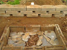 The pit is assembled and we put in a flu-like arrangement to vent it.