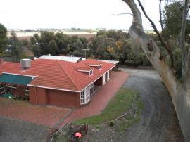 Front of the house with the "small shed" on the far side.