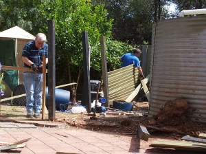 Pulling down the crappy fence around the water tanks.
