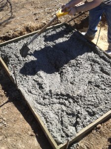 Pouring the pad for the boy's house.