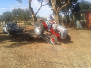 Sheldon coming home after some TLC. I only let dad unload the tractor because there's no roll bar.