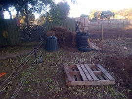 Went down to one compost bay and moved it up onto the reclaimed area. With the poultry and the babies, we really don't need a multi-bay compost system.