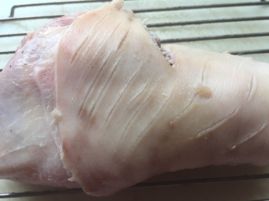 The skin shrinks back and the cuts in the skin open when you pour the boiling water over the hock.