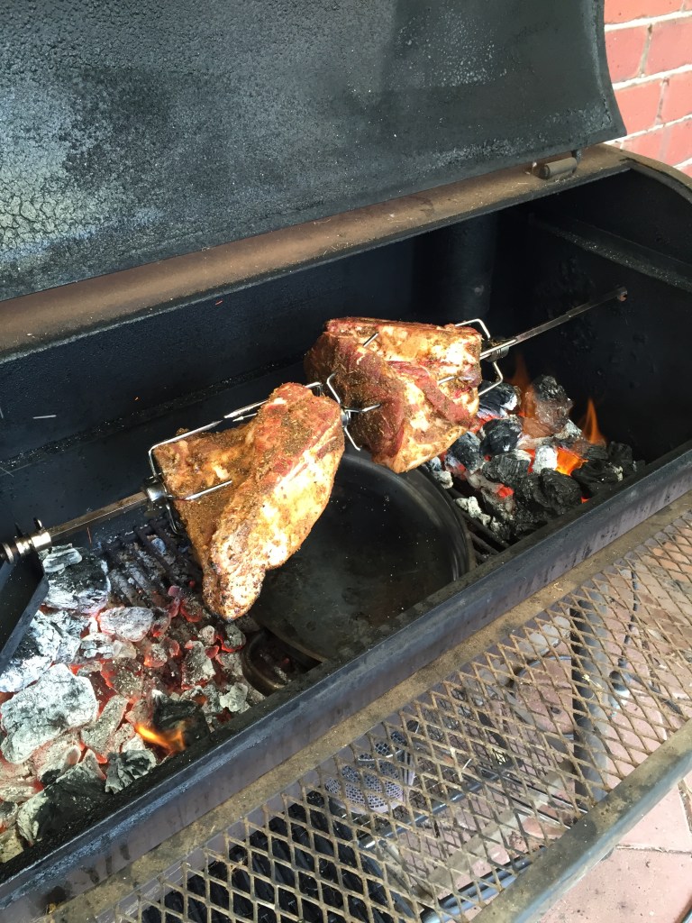 Cooking! Coals at either end and a drip tray in the middle.