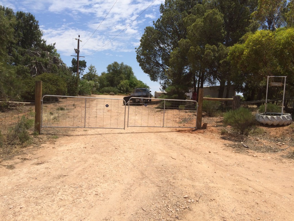 The place has never had front gates.  That may be because digging holes next to the driveway was so hard that I considered giving up partway through. :)