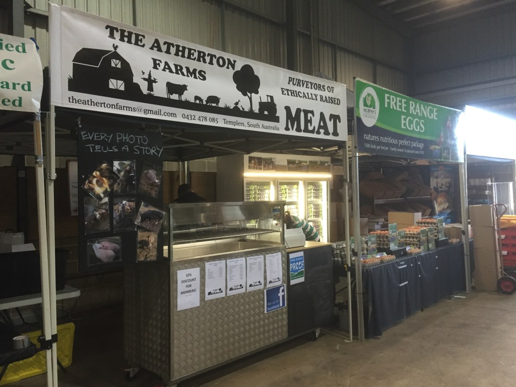 Our inside stall. We can set up permanently, which is really helpful, and it'll be sheltered in winter. Notice the awesome fridge - we scored it from a pizza shop that was closing down in the city. It took a little bit of work to fix up, but that thing is a beast!